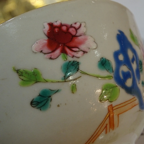 84 - A Chinese 18th century porcelain bowl with painted enamel flowers, diameter 11cm