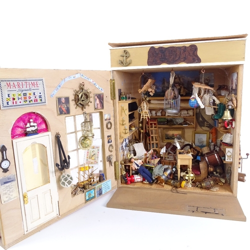 22 - A handmade Victorian Townhouse design doll’s house, containing various accessories, furniture, ornam... 