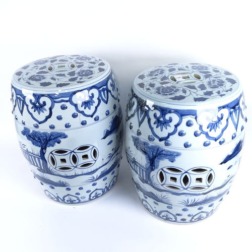 5 - A pair of Chinese blue and white porcelain barrel garden seats, pierced panels with figural and flor... 