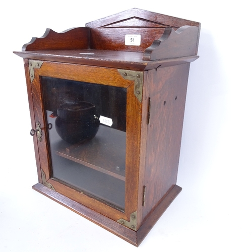 51 - A table-top oak smoker's cabinet, with glazed tobacco jar, cabinet height 38cm