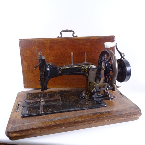 63 - An early 20th century German Frister & Rossman of Berlin mahogany-cased sewing machine, in inlaid tr... 