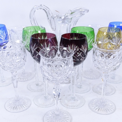 69 - A set of 7 harlequin hock glasses, 5 Tudor claret glasses, and a heavy cut-glass jug