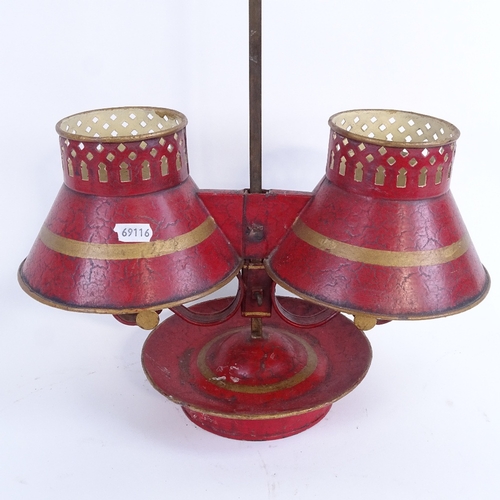 8 - A 19th century Toleware gilded and red painted brass rise and fall adjustable double candle stand wi... 