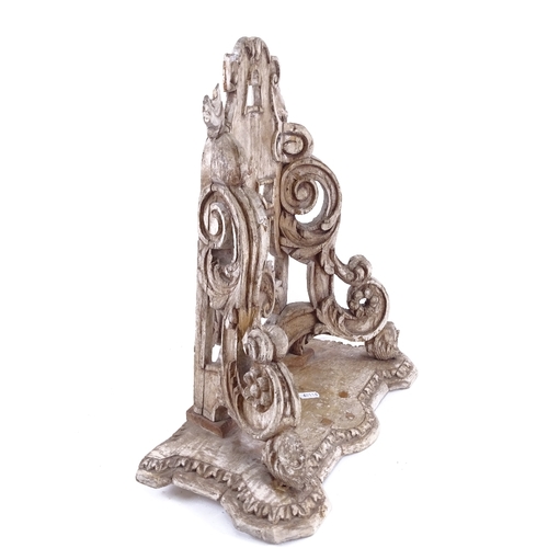 87 - An Antique carved wood wall bracket, figural supports with fleur de lis emblem, overall height 42cm