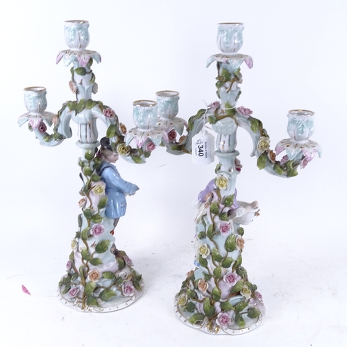 92 - Withdrawn - A pair of Continental porcelain 3-branch candelabra, supported by country figures, heigh... 