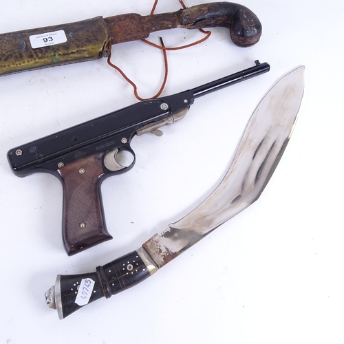 93 - An Indian kukri knife, Italian Oklahoma target pistol, curved sword etc (4)