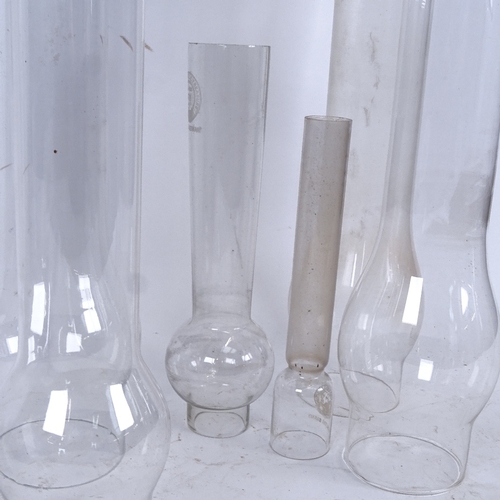 113 - 8 clear glass chimneys, of different sizes, for oil lamps