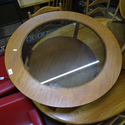 1302 - A mid-century teak circular 2-tier coffee table, with an inset smoked glass top, W86cm, H43cm