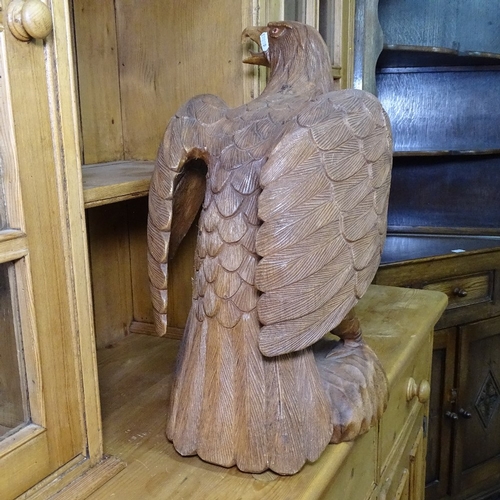 1316 - A carved hardwood study of an eagle, H52cm