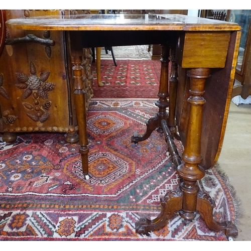 1329 - A Victorian figured walnut Sutherland table, with an inlaid marquetry top, raised on tapered columns... 