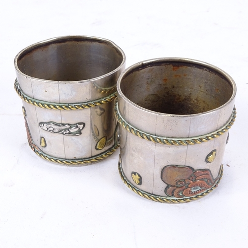 135 - A pair of American Aesthetic Movement tri-metal barrel salts, relief sealife decoration, height 4.5c... 