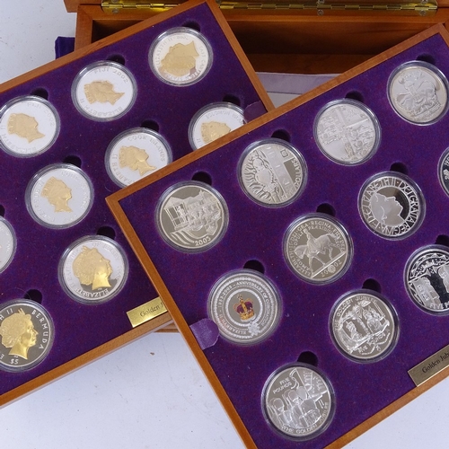 158 - A Queen Elizabeth II Golden Jubilee silver coin collection by the Royal Mint, in original satinwood ... 