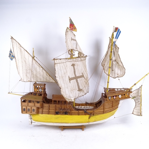 253 - A handmade model ship on stand of a 17th century galleon, length 85cm, height 66cm