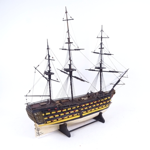 254 - A handmade model of a 19th century first rate ship of the line, on stand, length 65cm, height 55cm