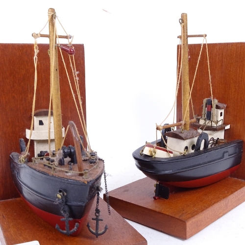 255 - A pair of handmade bookends in the form of a fishing boat, combined length 30cm, height 20cm