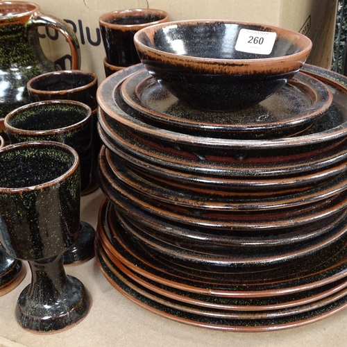 260 - A group of Winchcombe Pottery, including dinner plates, jug, beakers and goblets