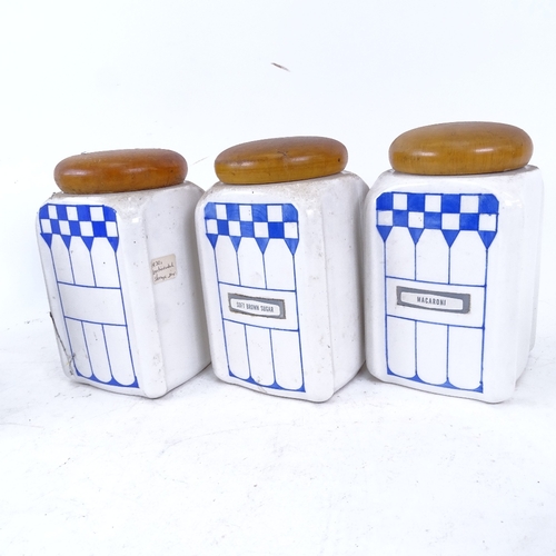 269 - A set of 9 German Art Deco ceramic kitchen storage jars, 7 are marked Felix, with turned wood lids, ... 