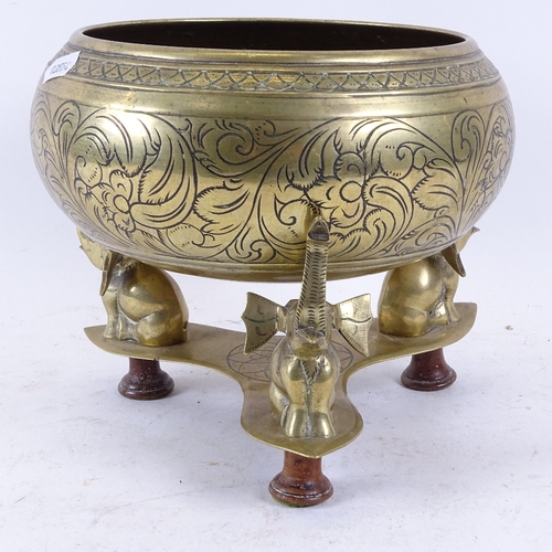 323 - An Indian brass incense burner/potpourri, on tri-form elephant stand, bowl diameter 21cm