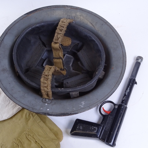 330 - A Second War Period British Army Brodie steel helmet, Arctic climate mittens, a Gat air pistol by T ... 