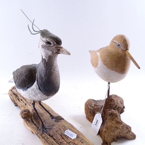 340 - A carved and painted wood sandpiper sculpture, by Geoffrey Bickley, and a ceramic and metal sculptur... 