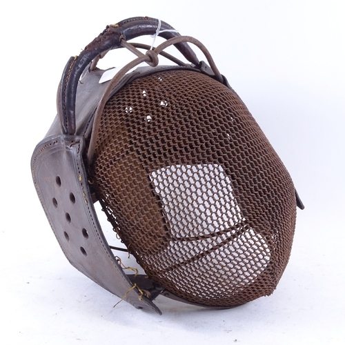 346 - An Italian 19th century iron and leather fencing mask, no maker's marks