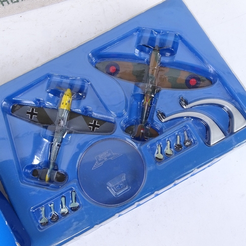 397 - A Corgi Battle of Britain Spitfire and Messerschmitt diecast model plane set, and a hand embroidered... 