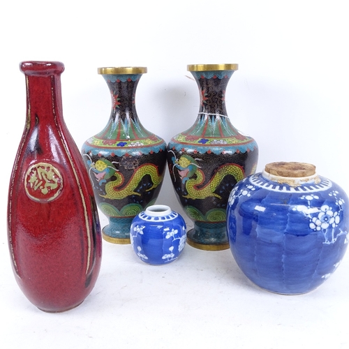 441 - A pair of Chinese cloisonne enamel vases, blue and white prunus pattern ginger jar, and a red glazed... 