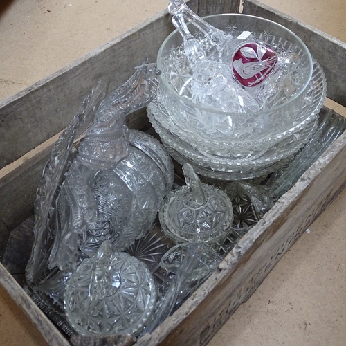 482 - A weathered pine crate containing various moulded glass bowls, jars etc