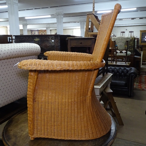 1355 - A contemporary Arts and Crafts style rattan armchair