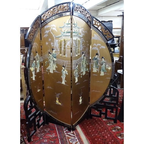 1360 - An ornate Oriental black lacquered 4-fold screen, with allover painted and gilded and applied decora... 