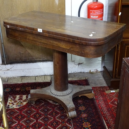 1367 - A Regency rosewood fold over card table, raised on barrel turned column and platform base, W92cm, H7... 