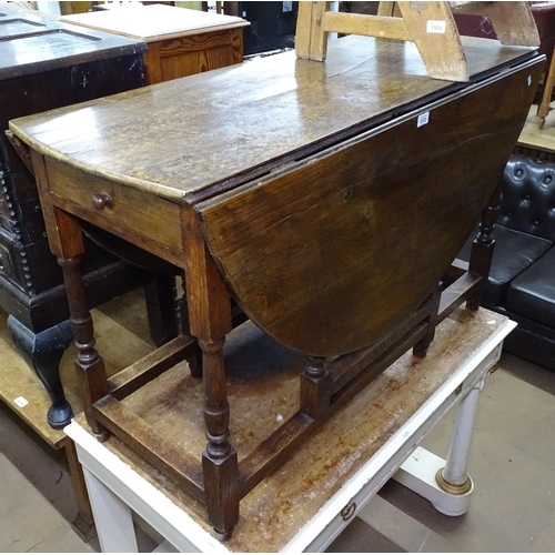 1372 - A large Antique oak gateleg table, with double-end frieze drawer, L115cm