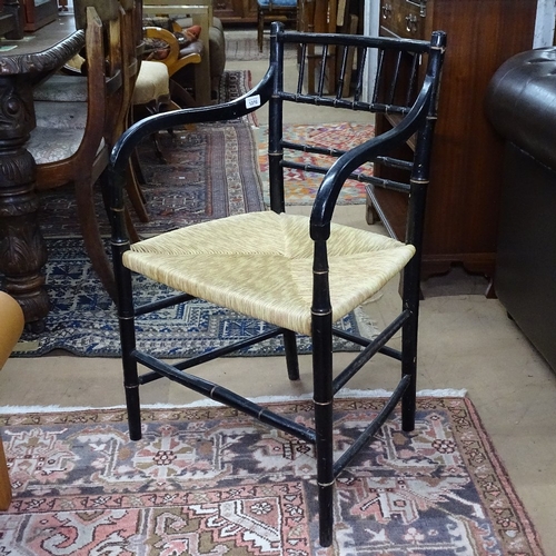 1376 - A 19th century Aesthetic ebonised and gilded armchair, in the manner of Godwin