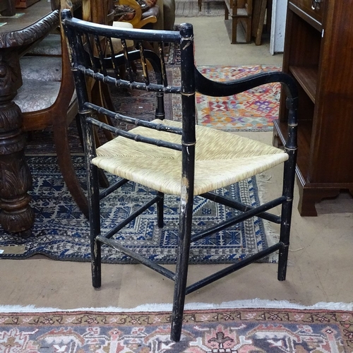 1376 - A 19th century Aesthetic ebonised and gilded armchair, in the manner of Godwin