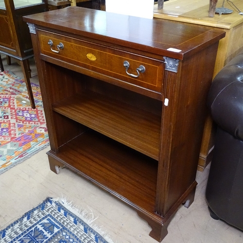 1389 - A mahogany satinwood-strung bookcase, with single frieze drawer and open shelves under, bracket feet... 