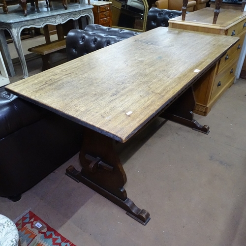 1394 - A 1930s oak rectangular refectory dining table, on pegged tablet ends, L153cm, H76cm