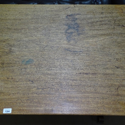 1394 - A 1930s oak rectangular refectory dining table, on pegged tablet ends, L153cm, H76cm