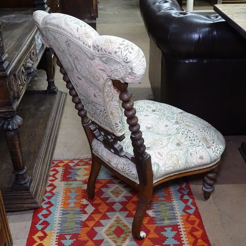 1396 - A Victorian upholstered nursing chair, with Prince of Wales design back on barley twist legs