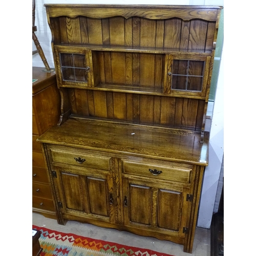 1401 - A modern oak 2-section dresser, with fitted drawers and fielded panelled cupboards, on stile legs, W... 