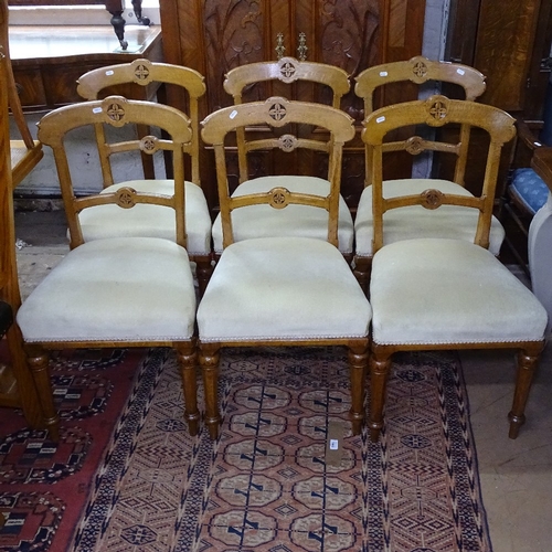 1405 - A set of 6 Victorian oak Gothic dining chairs, with upholstered seats and tapered legs