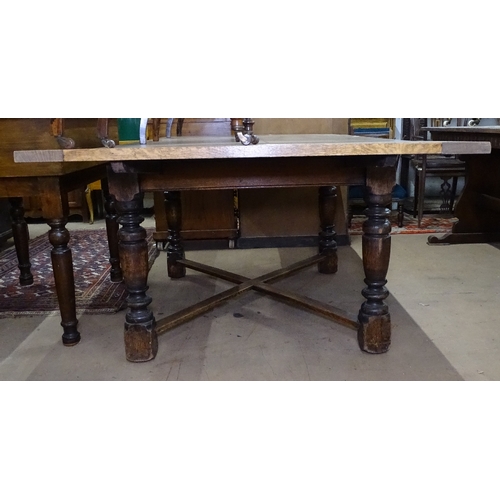 1406 - A large oak draw leaf dining table, on cross stretchers and baluster turned legs, L120cm extending t... 