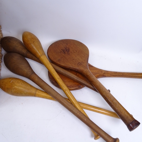 495 - 2 wickerwork baskets, containing Vintage badminton rackets, stoolball bats, American football etc