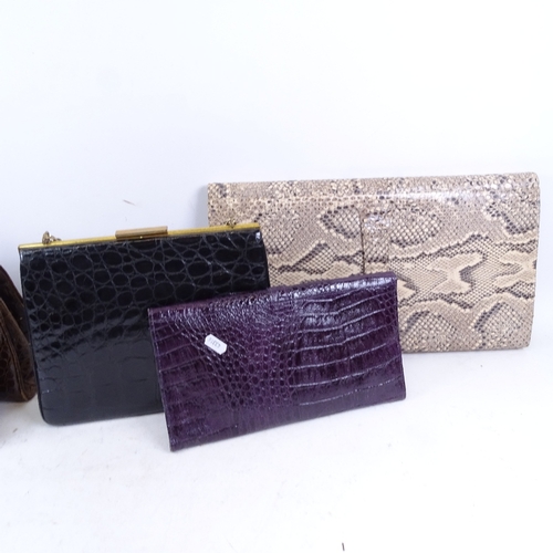 519 - A large snakeskin clutch bag, length 43cm, a crocodile skin clutch bag, and 3 leather handbags