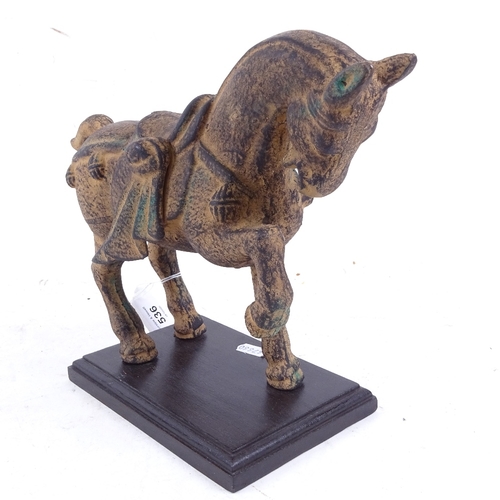 536 - An Oriental patinated iron Tang style horse on wooden plinth, height 22.5cm