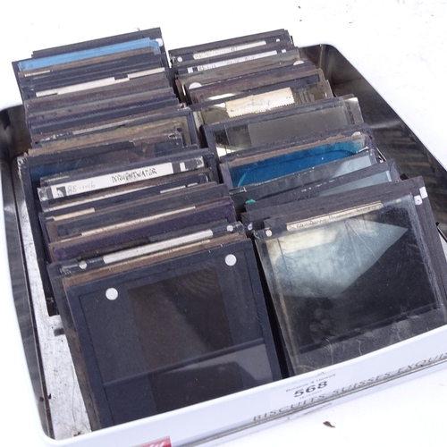 568 - A box of glass photographic slides