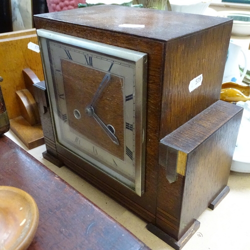 579 - A 2-train mantel clock, height 23cm, a wig stand, bookends, writing slope, boxes etc