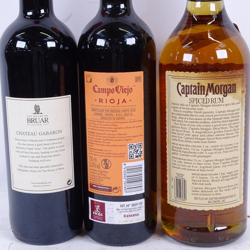 588 - A litre of Captain Morgan Original Spiced Rum, and 2 bottles of wine