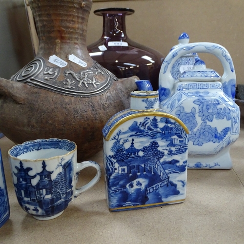 593 - Amethyst glass pot, height 24.5cm, ruby glass vase, Oriental teapots and caddy, and a pottery vase