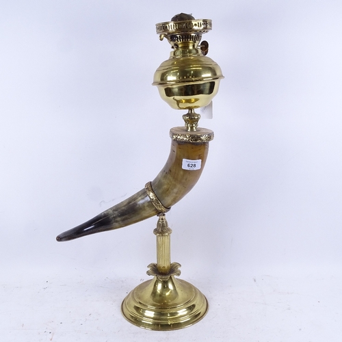 628 - A brass and buffalo horn oil lamp, with opaque glass shade, height to top of shade 75cm