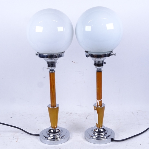 629 - WITHDRAWN: Pair of retro style chrome-mounted table lamps, with globular glass shades, 43cm